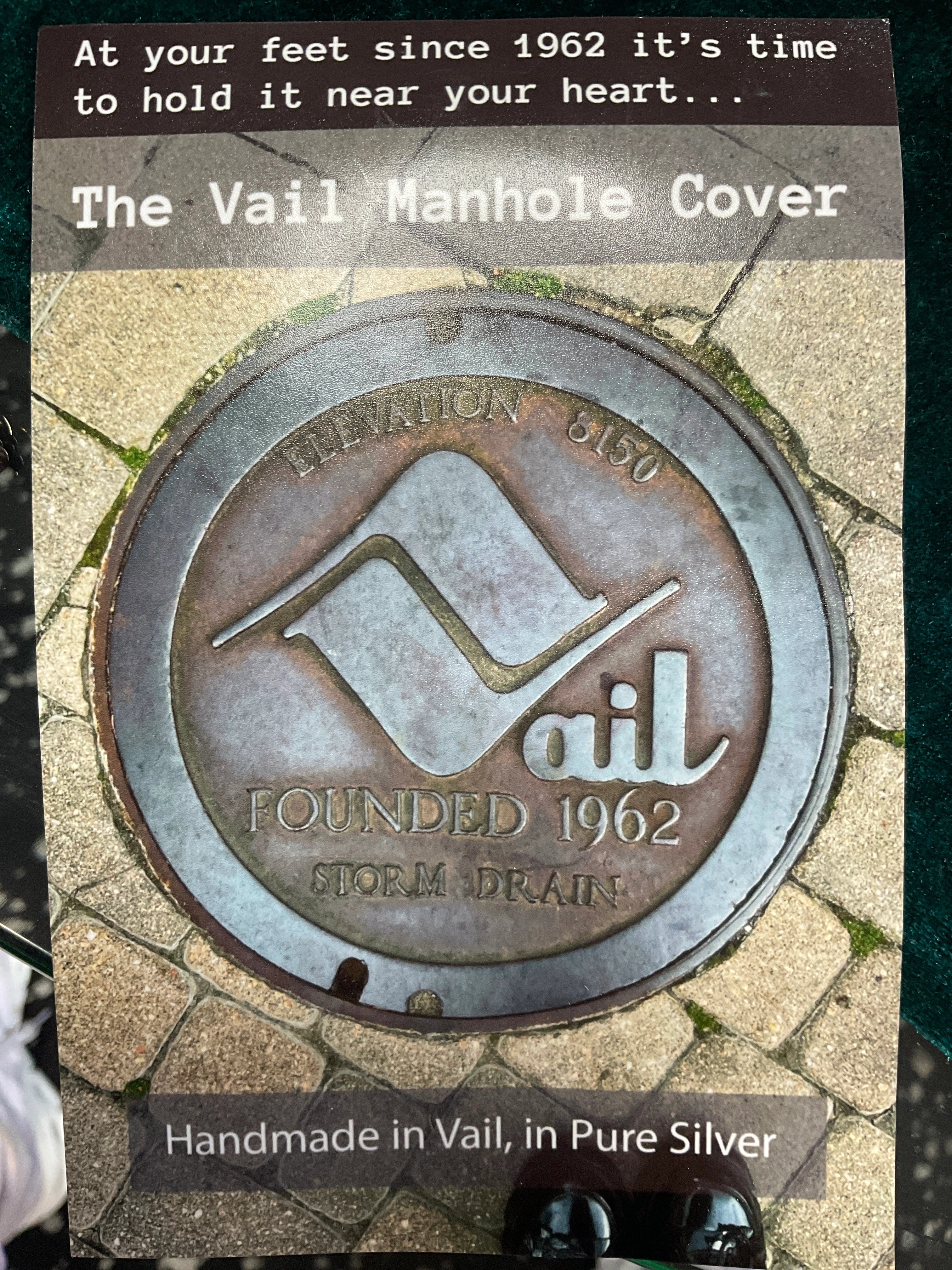 Handmade Vail Manhole Cover pendant crafted from pure silver.