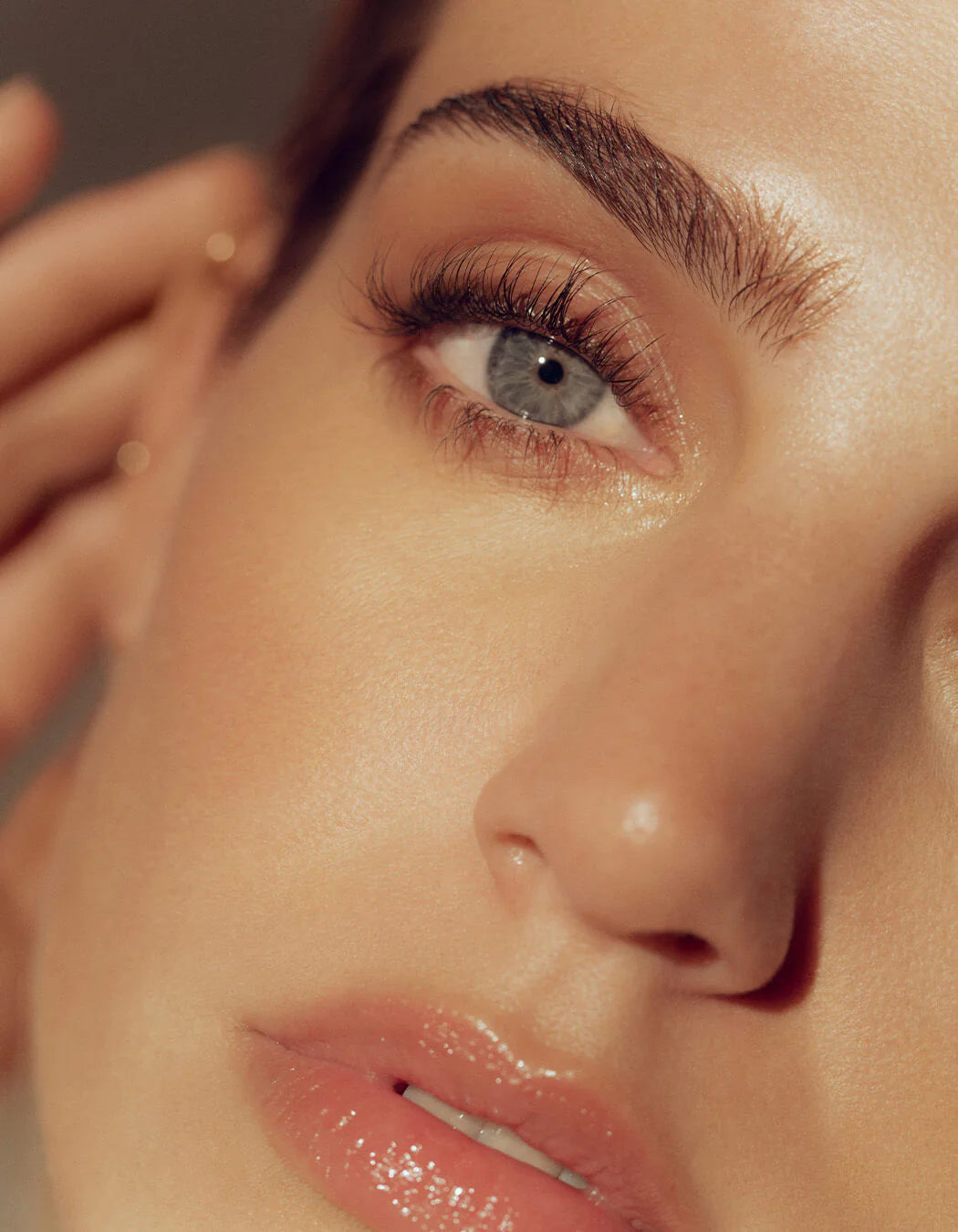 Applying RevitaLash Cosmetics Hi-Def Brow Pencil to fill and define eyebrows.
