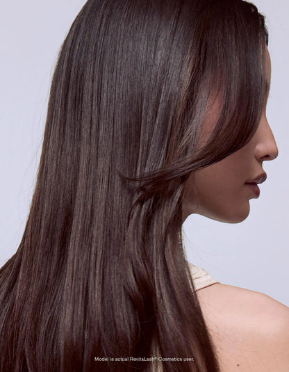 Applying RevitaLash Cosmetics Leave-In Hair Mask &amp; Conditioner to damp hair.