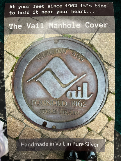 Handmade Vail Manhole Cover pendant crafted from pure silver.